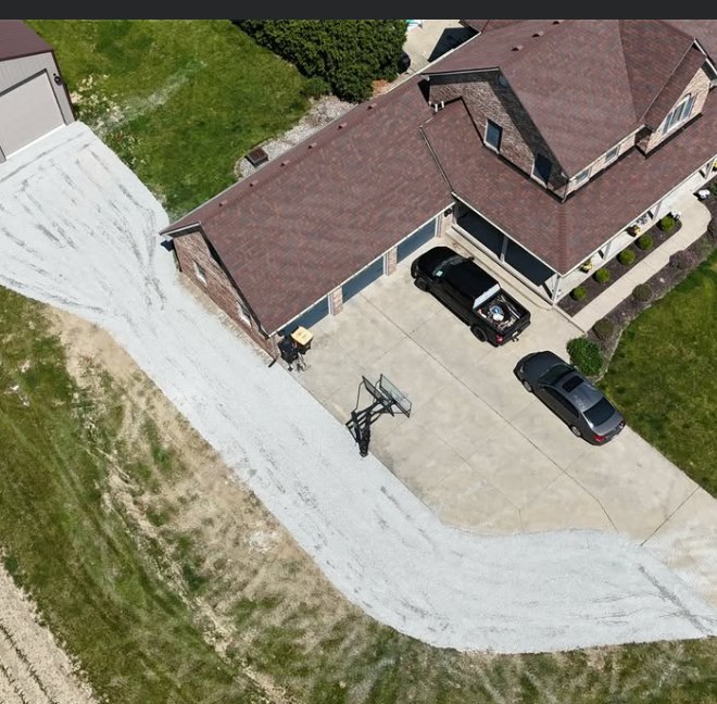 Aerial view of a freshly graded and graveled driveway installed by Jannings Property Solutions